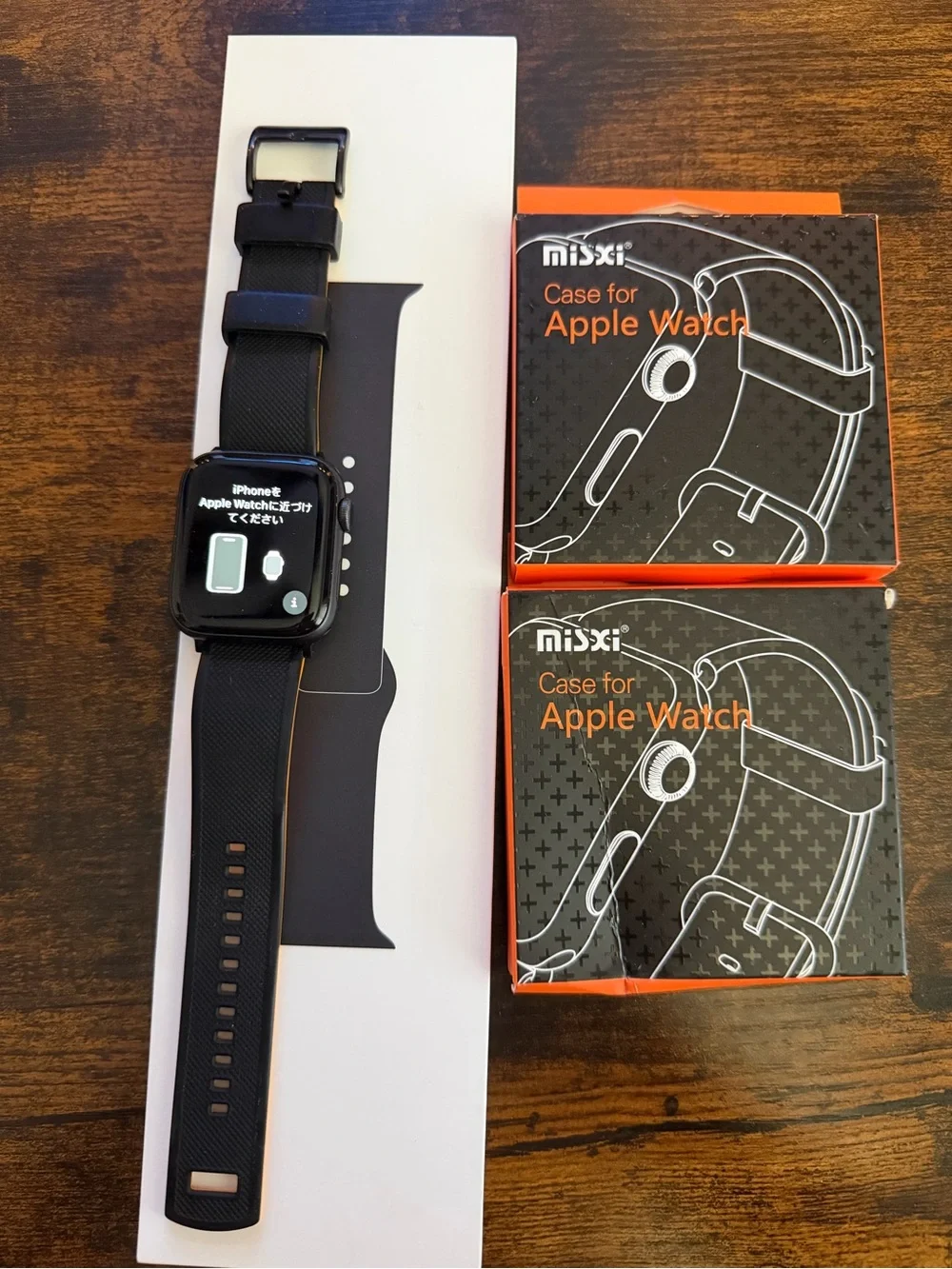 Apple Black Smartwatch with Black Silicone Band and White Magnetic Charger